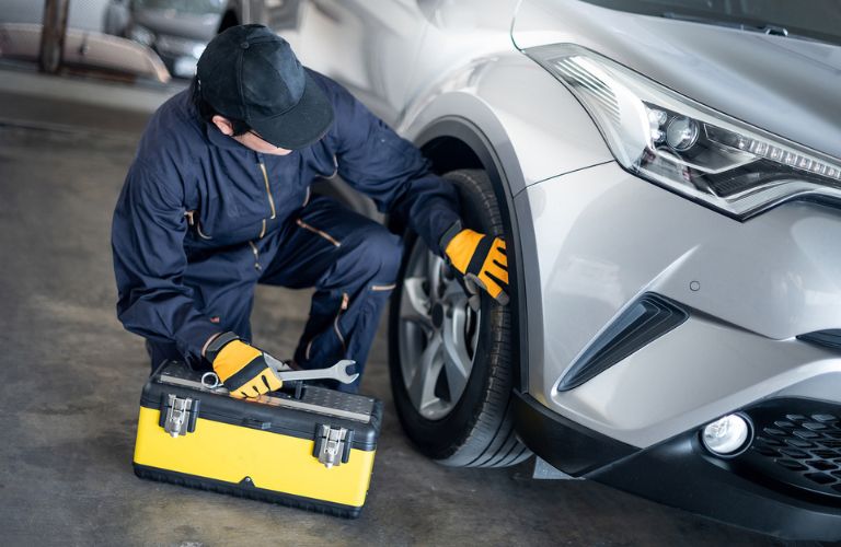 Service personnel checking wheel